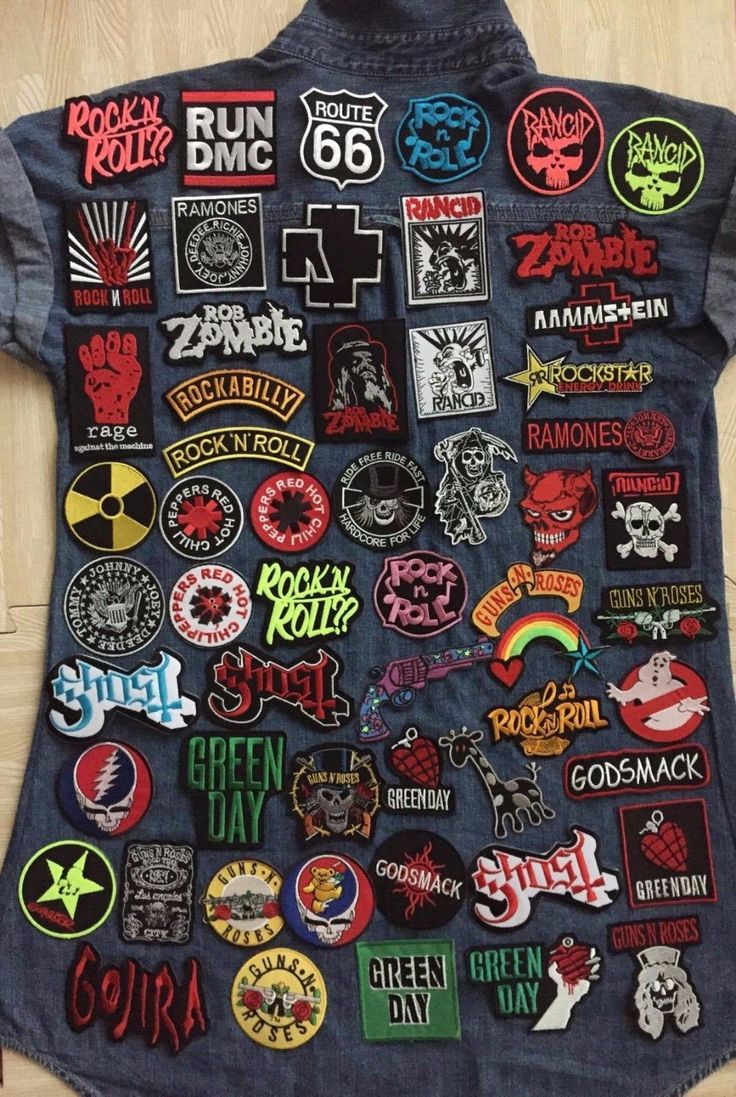 a denim jacket covered in patches and stickers