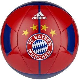 a red soccer ball with blue and yellow stars on the side, sitting in front of a white background