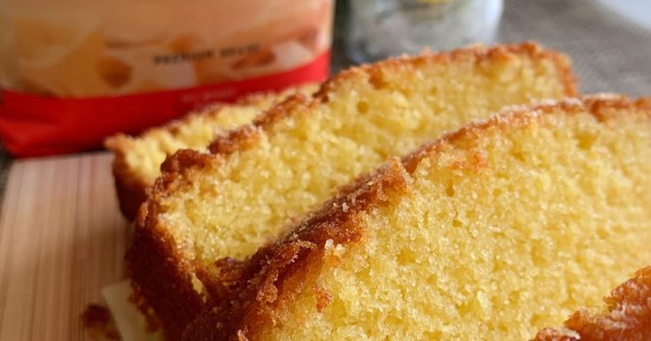 three slices of pound cake sitting on top of a cutting board next to a bag of semollina