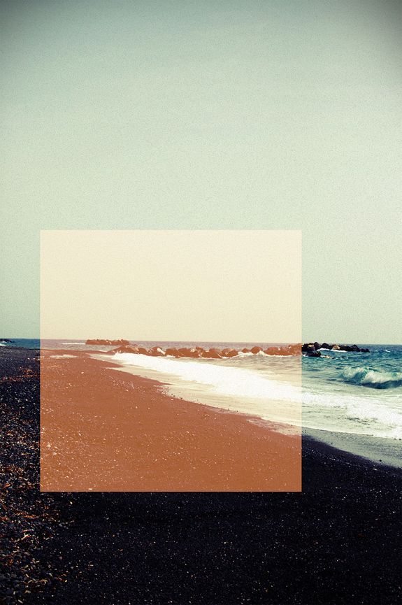 an image of a beach with waves coming in from the ocean and sand on the shore