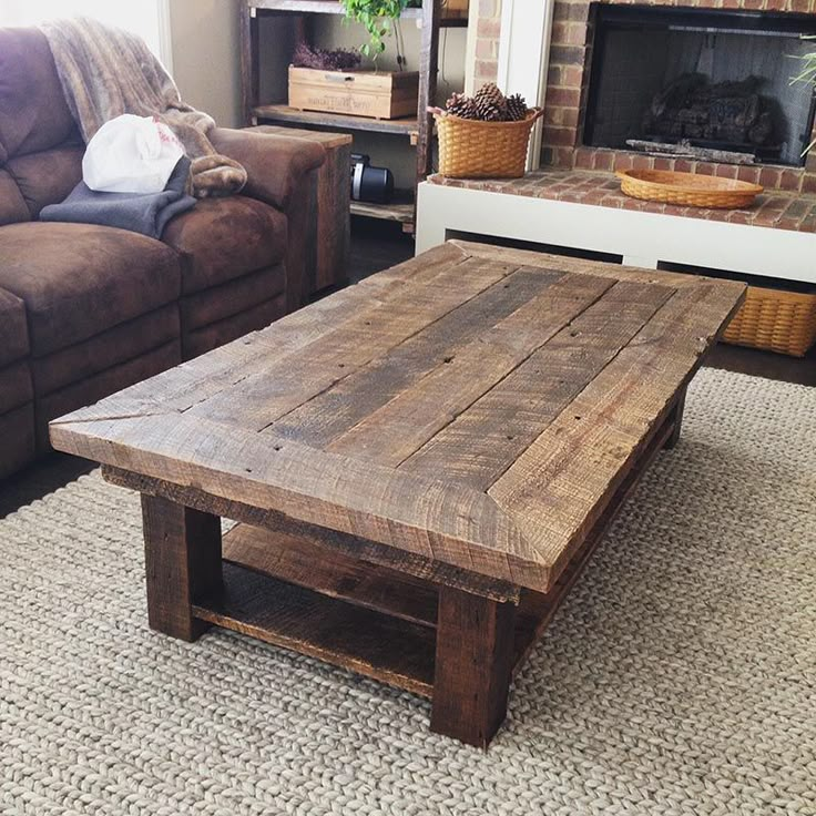 a wooden table sitting in front of a brown couch