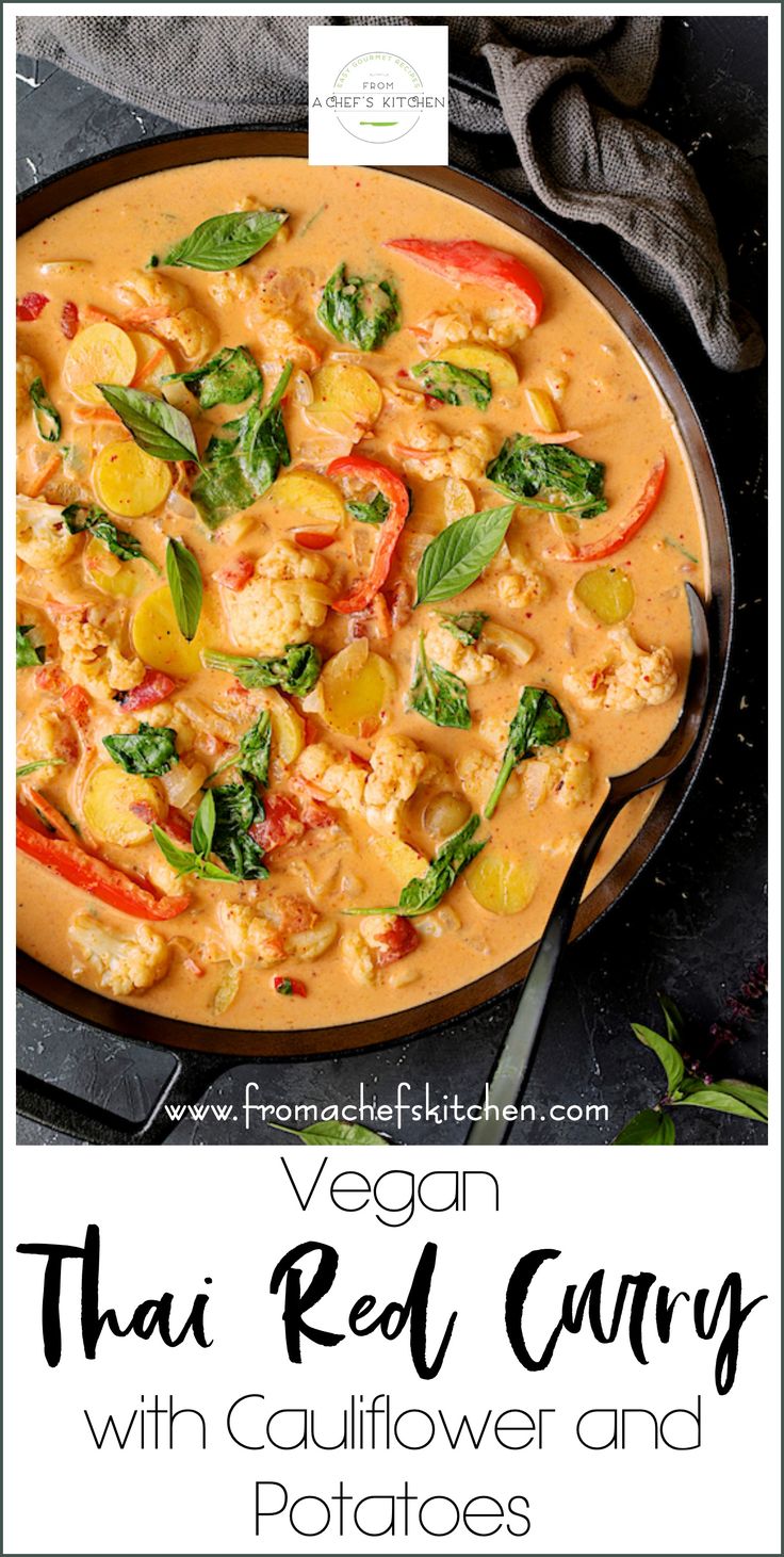 thai red curry with cauliflower and potatoes in a skillet on a table