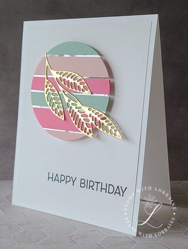 a happy birthday card with a leaf on the front, and a circle design on the back