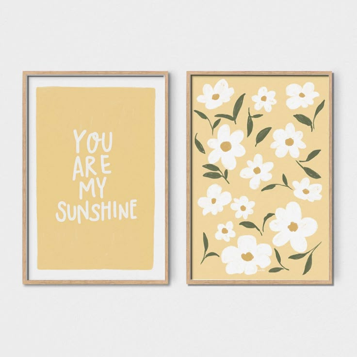 two framed art prints with the words you are my sunshine written in white and yellow