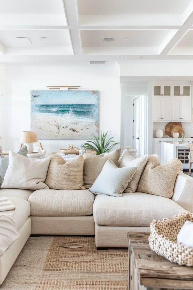 a living room filled with furniture and a painting on the wall above it's headboard