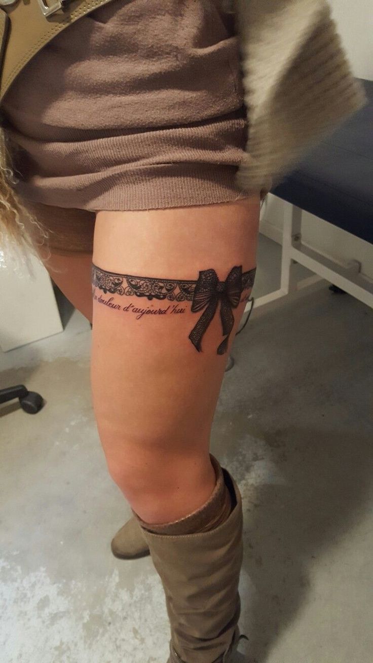 a woman's leg with a tattoo on it