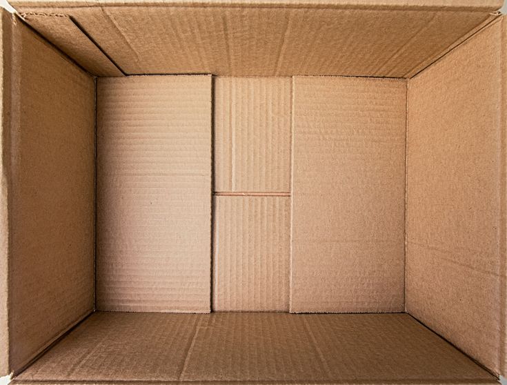 an open cardboard box sitting on top of a table