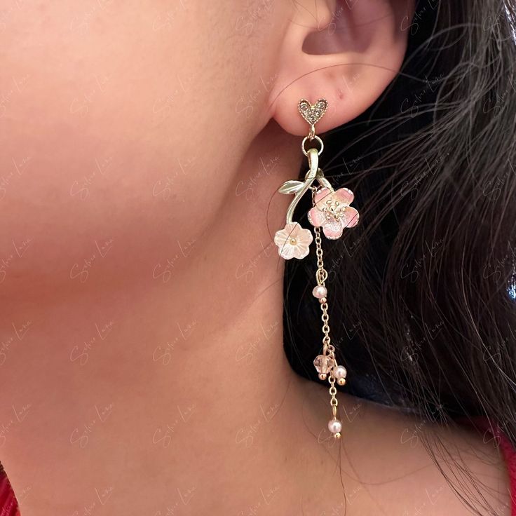 A pair of elegant sakura Japanese cherry blossom asymmetric dangle drop earrings features a heart stud and a long tassel cherry blossom enamel charm, asymmetric design which give the pair a unique look. Materials: Alloy metal, resin beads, rhinestones, enamel Shipping Policy: Orders will be shipped within 1-3 business days. Economy shipping will take 7-14 days to arrive and standard shipping is 1- 4 days for U.S. orders. International shipping time is depended per country and per shipping method Sakura Japanese, Cherry Blossom Flower, Asymmetrical Earrings, Cherry Blossom Flowers, Japanese Cherry Blossom, Resin Beads, Enamel Charms, Asymmetrical Design, Heart Studs