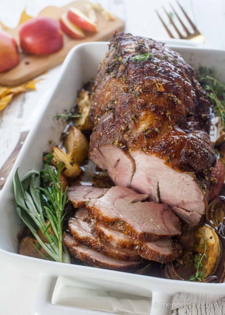 a roasting pan filled with meat and vegetables