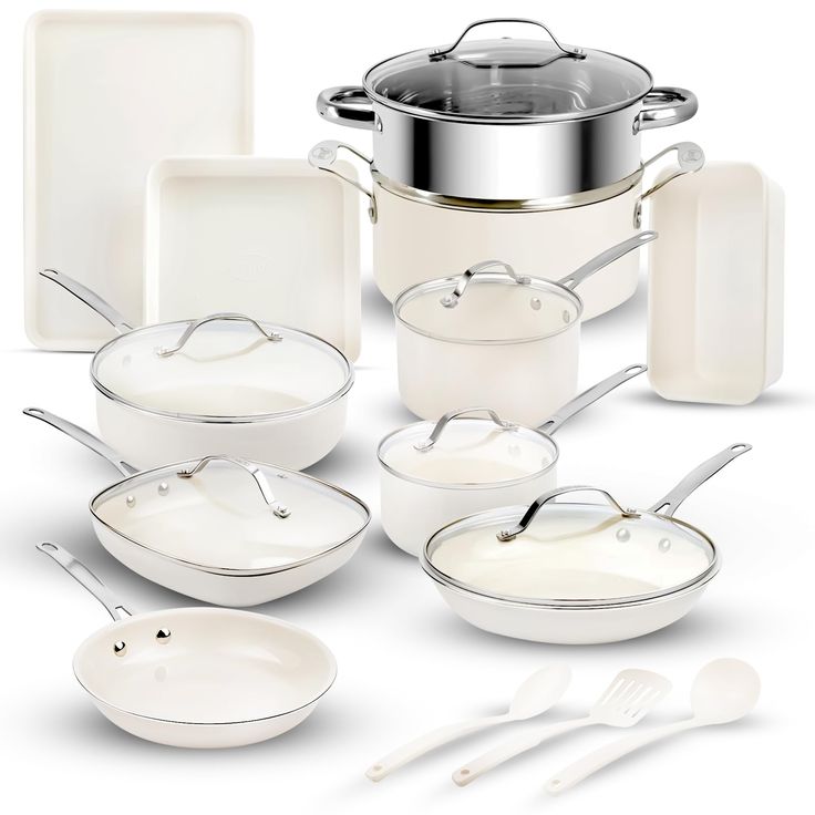 an assortment of white cookware including pots, pans and utensils on a white background