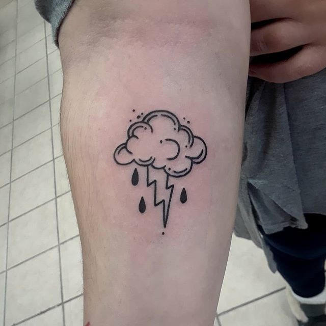 a black and white photo of a cloud with a lightning bolt tattoo on the arm