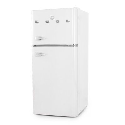 a white refrigerator freezer sitting on top of a white floor next to a wall