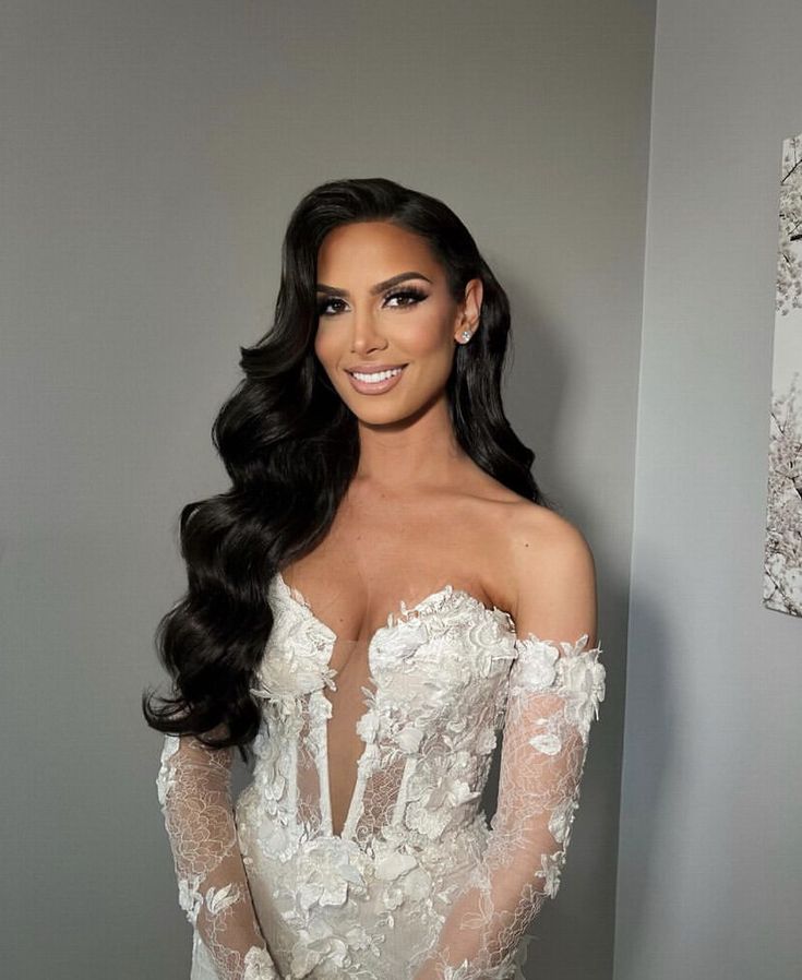 a woman in a wedding dress posing for a photo