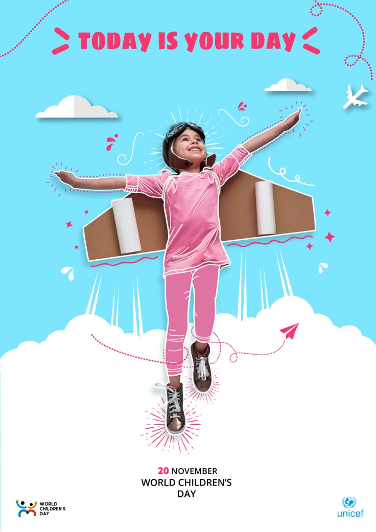 a girl in pink jumps up into the air with her arms spread out, while holding a cardboard airplane