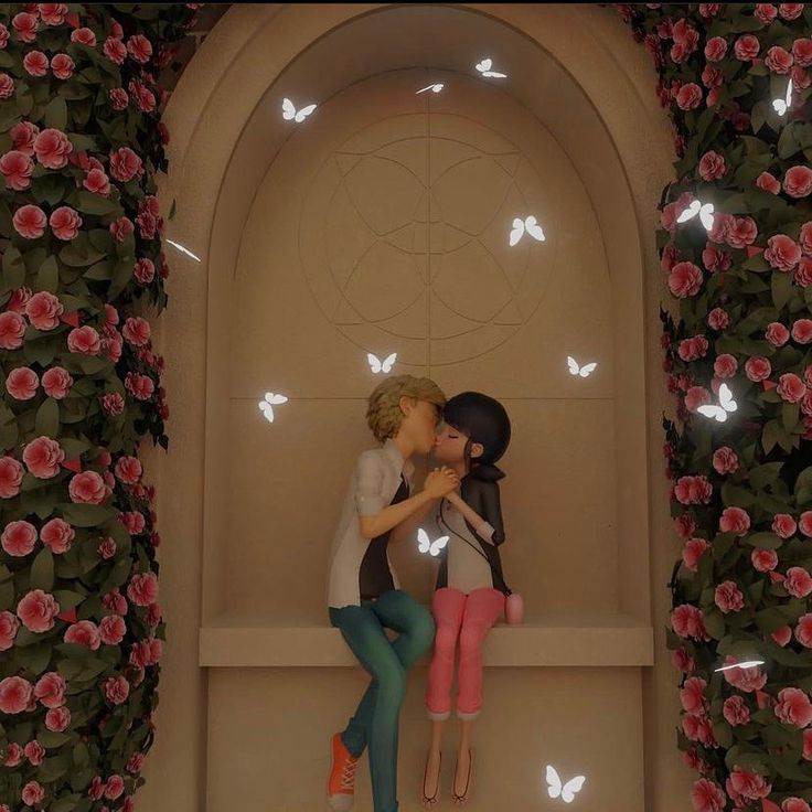 a couple kissing in front of a wall with flowers and butterflies on it's sides