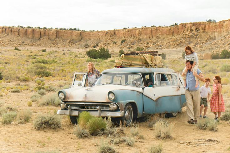 the glass castle trailer is shown with an image of people standing in front of a car