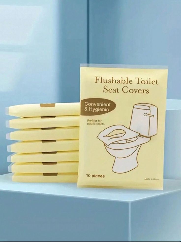 a pack of flushable toilet seat covers sitting next to each other