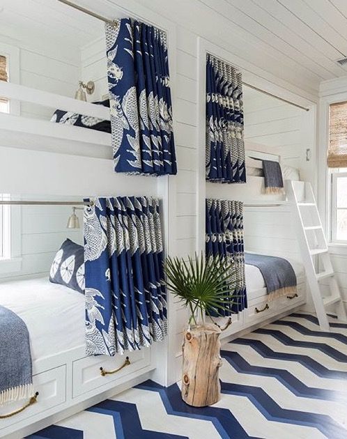 an instagram page with two bunk beds and blue striped rugs on the floor