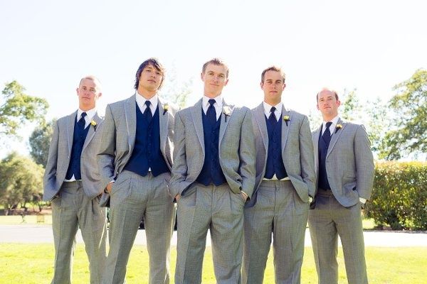 a group of men in suits standing next to each other