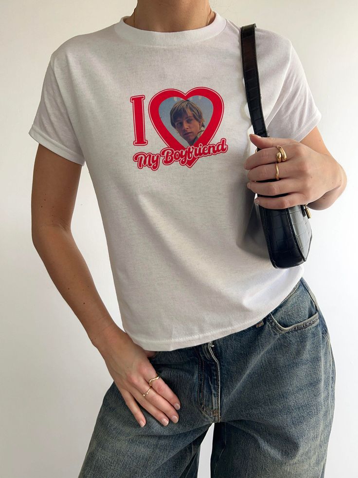 Love My Boyfriend and Girlfriend 90s Baby Tee 90's YOUTH baby tee style tshirts! Hi! If you have any questions or want to make changes to your order, please message me. ⭐HOW TO ORDER - Please Choose the SIZE and COLOR From Drop Down Menu. ⭐MATERIAL - Cotton Polyester blend fabrics with direct to garment process. Everything is made in house. ⭐SIZES - Please check the size chart before you purchase, they are womens cut and run average, not big, not small.  XSmall to 2XL sizes are the only sizes available.  ⭐SHIPPING - Processing times can verify, dark color shirts do take longer to make, it should take about 3-6 business days to make your item. You can rush an order by choosing faster shipping and leaving me a note at checkout for the date you need it by. If you need it very fast ASAP please Boyfriend And Girlfriend Tshirts, Custom Shirt For Boyfriend, I Have A Girlfriend Shirt, Girlfriend Shirts For Boyfriend, I Love My Boyfriend Shirt, Boyfriend Shirt Outfits, Boyfriends Shirt, I Love My Girlfriend Shirt, Baby Tees 90s