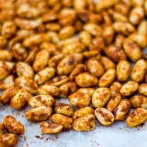 roasted nuts on a baking sheet ready to be cooked