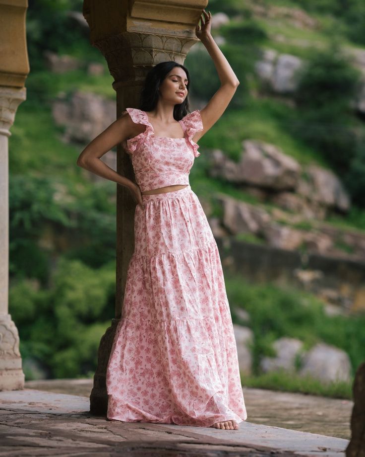 Long and voluminous three tiered skirt in soft pink blossom print and made from organic cotton. Can be worn with the Sakura top for a perfect co-ordinated wedding guest outfit. Or dress it down with a T-shirt or cropped top. The skirt is long and suited to wearing with heels or you can roll it over once at the waist for a daytime look. Side zip with clasp at the waist. Models are between sizes 8-10 and are wearing size S XXS Length from hips 112cm, Waist 57cm, Hips 106cm XS Length from hips 112c Three Tiered Skirt, Long Tiered Skirt, Stylish Short Dresses, Printed Fashion, Blossom Print, Tiered Maxi Skirt, Ethical Brands, Pink Blossom, Tier Skirt