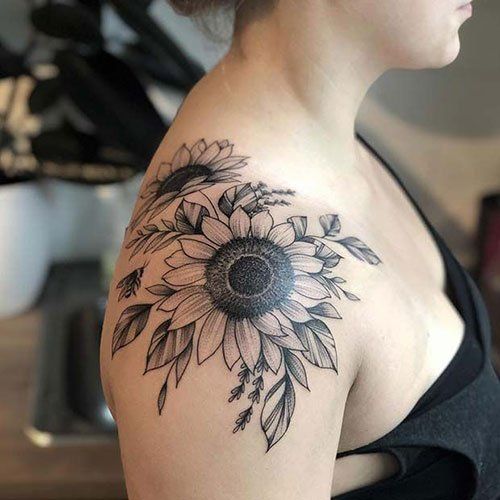 a woman with a sunflower tattoo on her shoulder