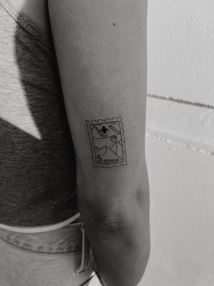 a woman with a small tattoo on her arm