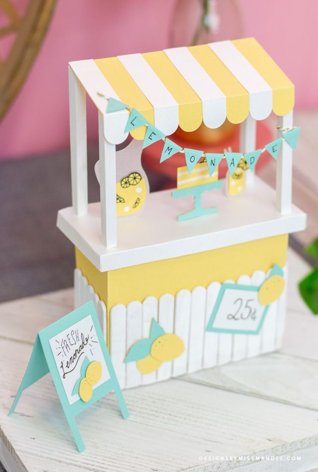 a small yellow and white carton with lemonade on it's side sitting on a table