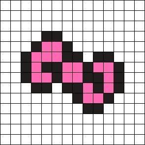 a cross stitch pattern with pink and black squares in the shape of an elephant's head