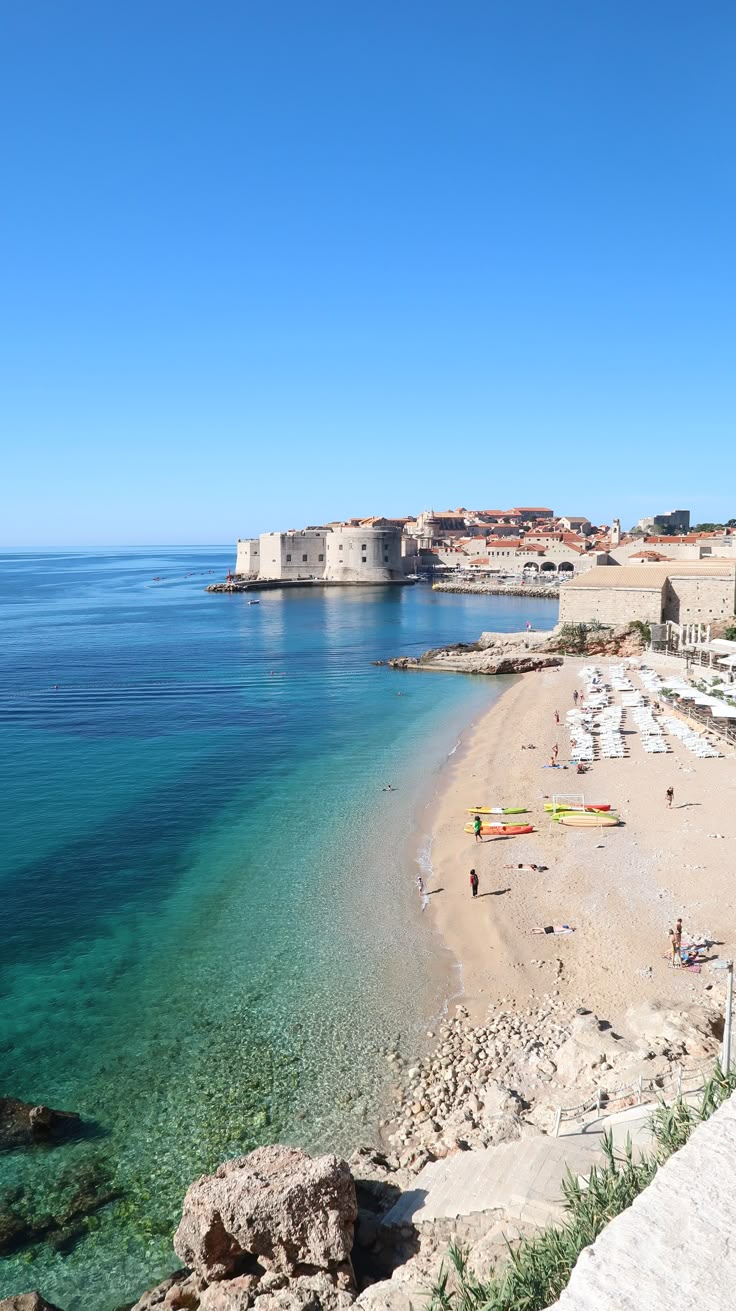 the beach is clean and clear for people to enjoy in it's natural surroundings