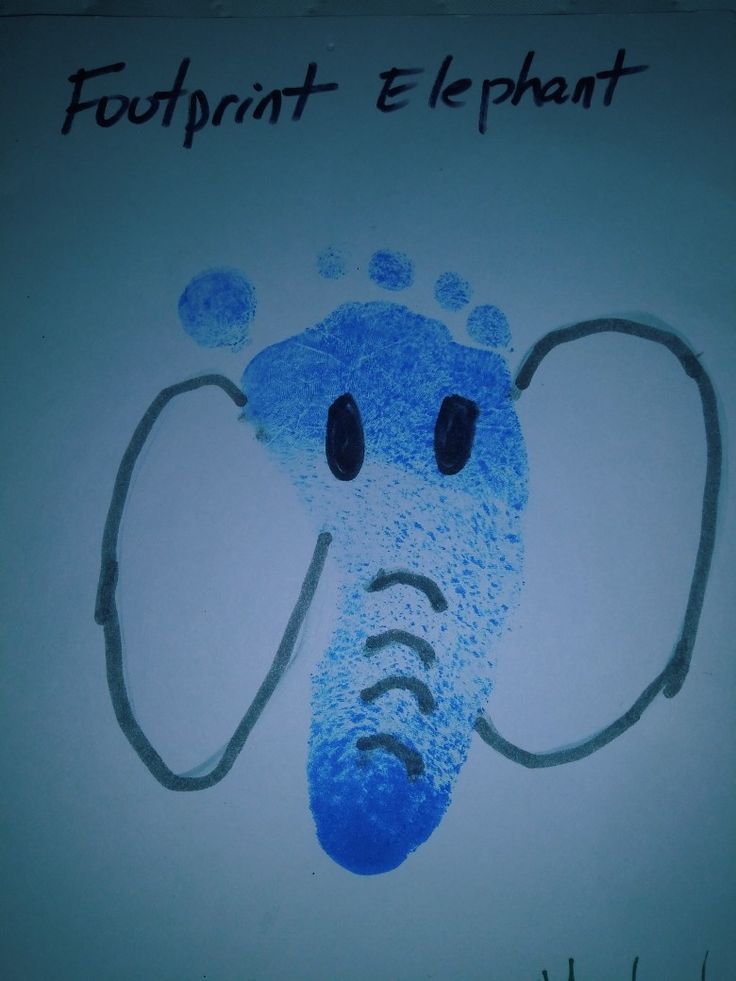 an elephant's face is drawn in blue ink on a white paper with the words footprint e elephant