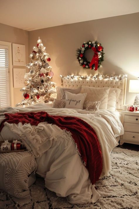 a bedroom decorated for christmas with white and red decor