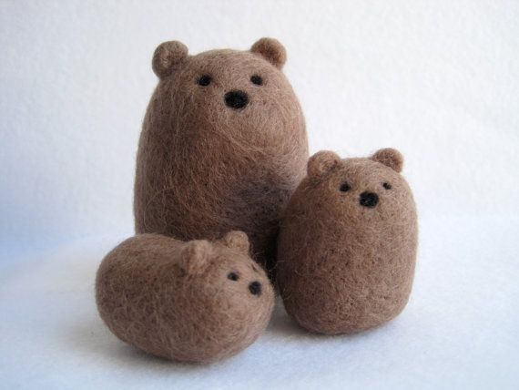 three stuffed bears sitting next to each other