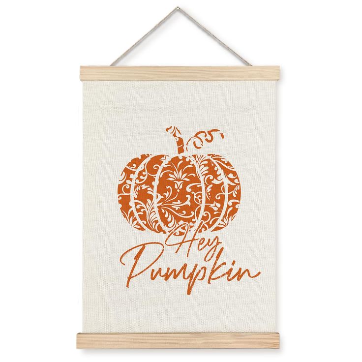 a white wall hanging with an orange pumpkin and the words, happy pumpkin on it