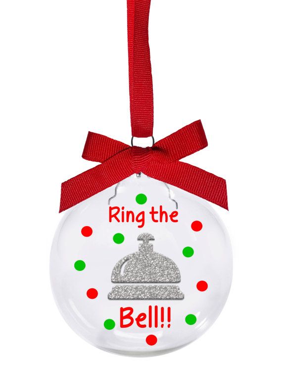 a glass ornament with the words ring the bell on it's side