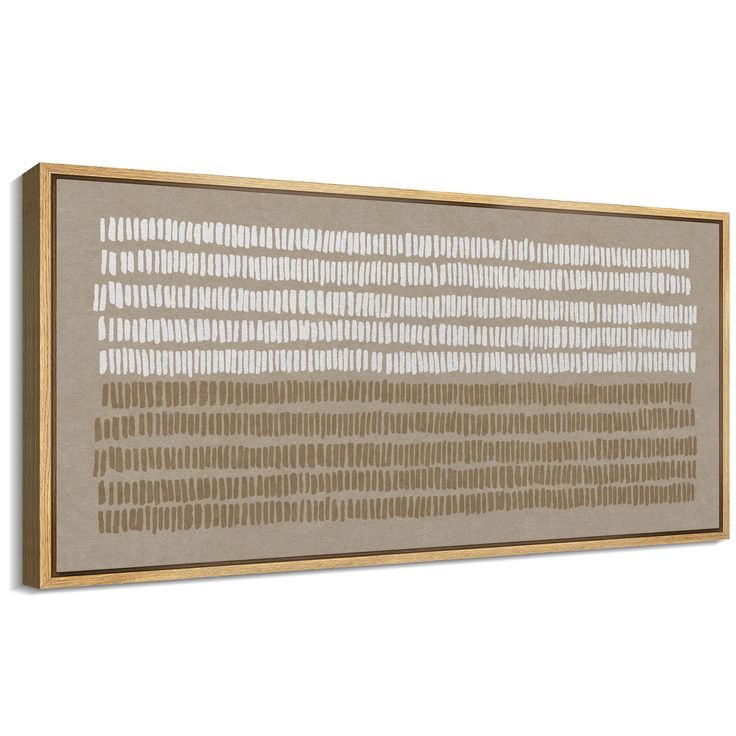 a beige and white wall hanging on the side of a wooden framed art piece with lines drawn