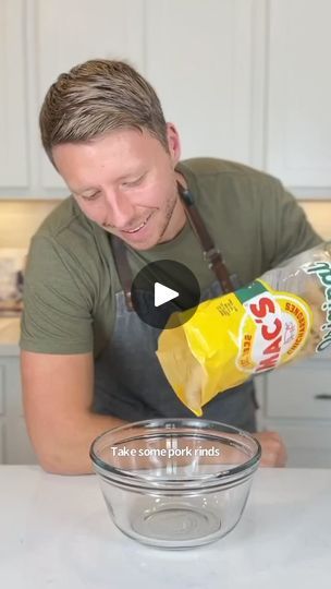 a man pouring mustard into a glass bowl