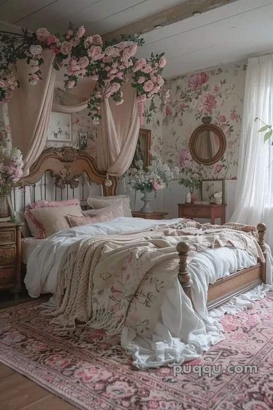 a bedroom with pink flowers on the wall and bed in the center, along with an area rug