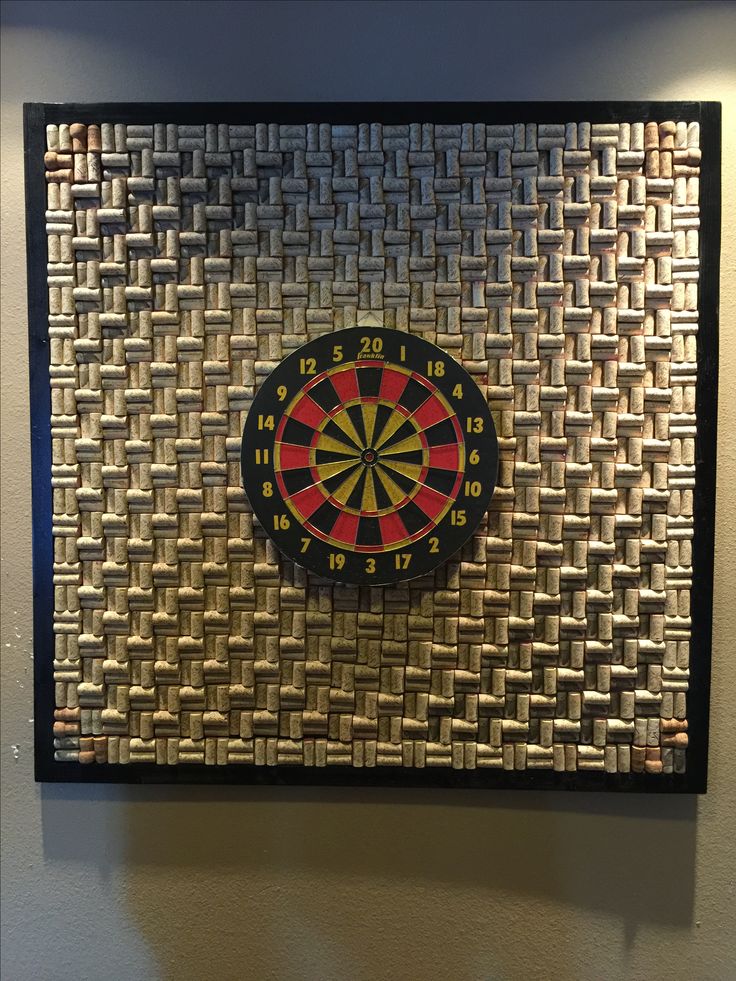 a dart board mounted to the side of a wall