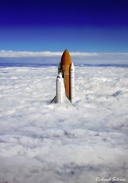 a space shuttle is flying through the clouds