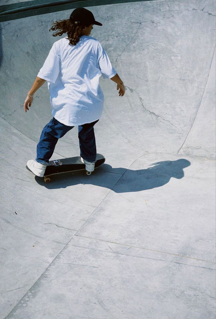 a person riding a skate board at a skate park