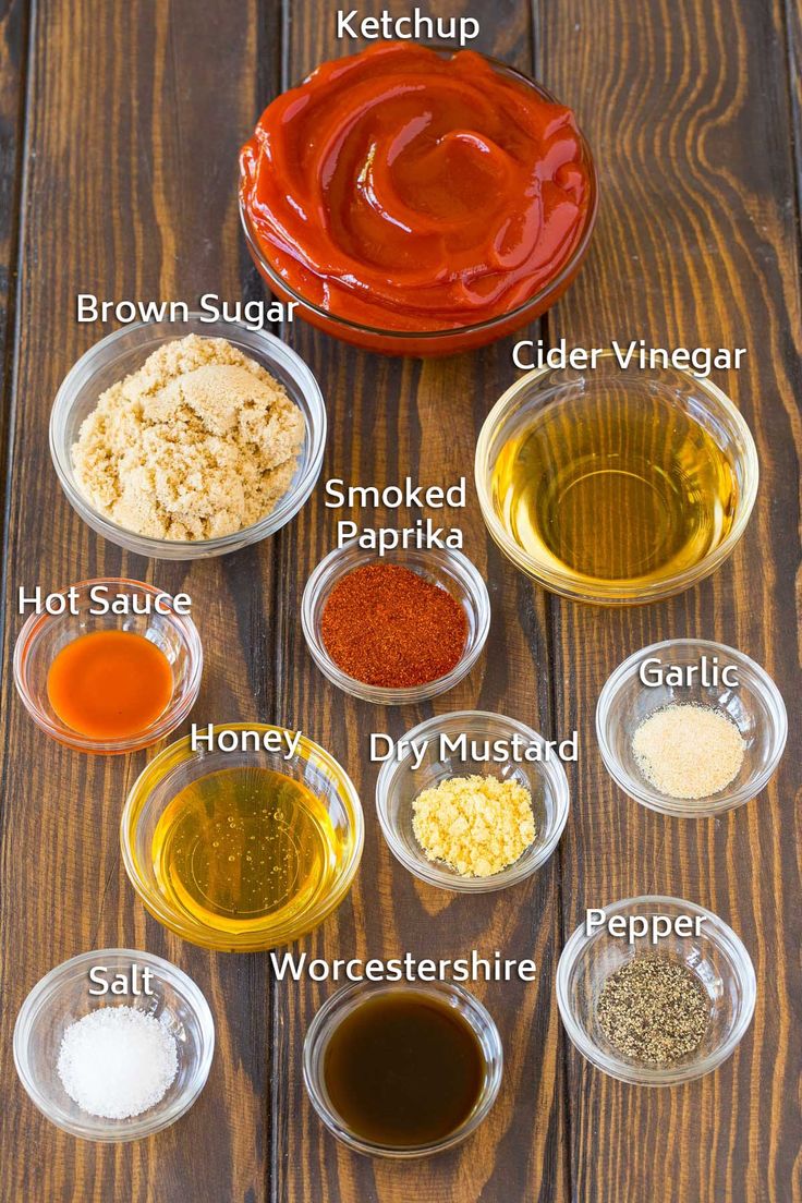 the ingredients to make homemade barbecue sauce are shown in bowls on a wooden table top