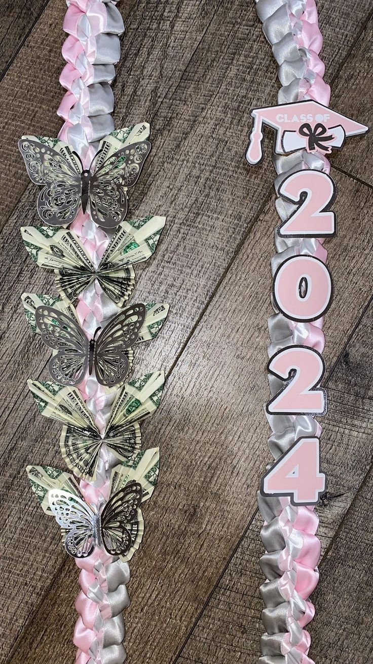 two pieces of paper with butterflies on them and the word 2012 spelled out in pink