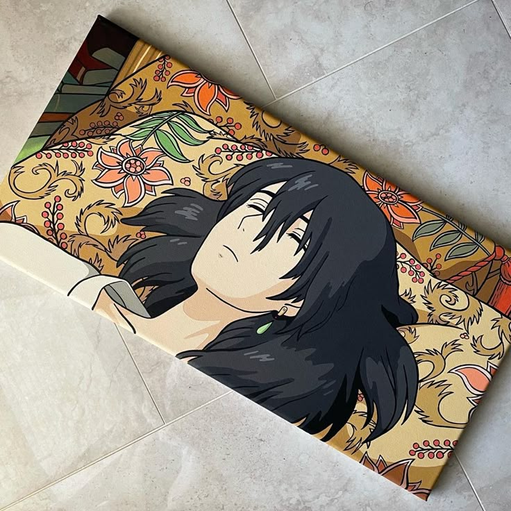 an anime character is laying on the floor next to a rug with flowers and leaves