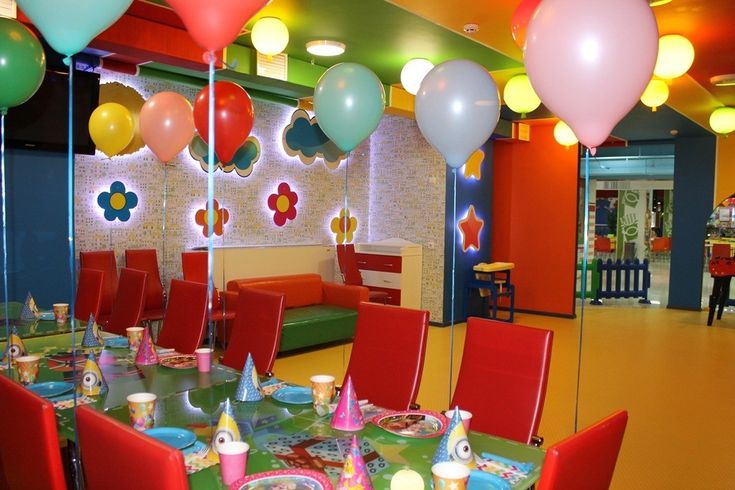 a dining room filled with lots of colorful balloons