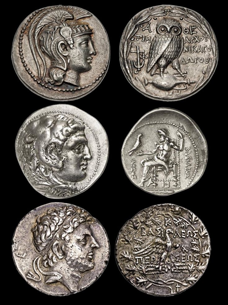 four ancient roman coins, one with an eagle and the other with a woman's head