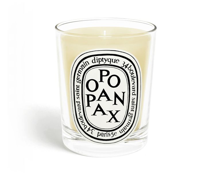 a candle that is sitting in front of a white background with the words chne on it