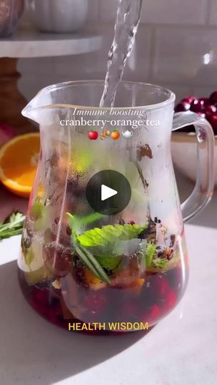 a pitcher filled with liquid sitting on top of a counter