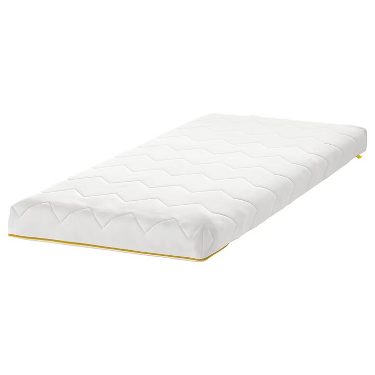 the mattress is white and has gold trim